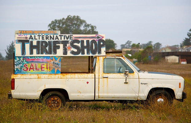 Old truck with sign for Alternative Thrift Shop